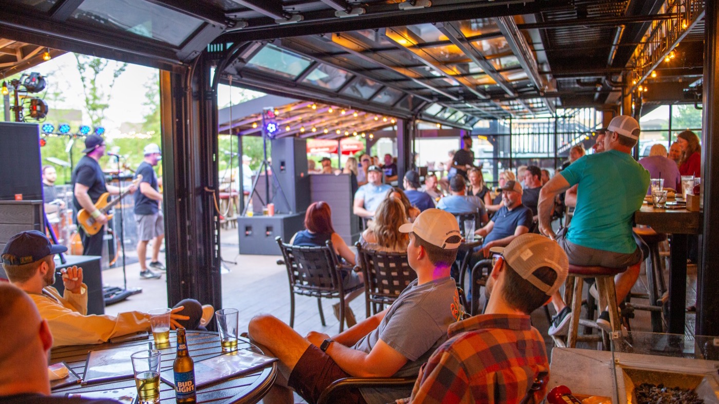 Live band playing to a full patio